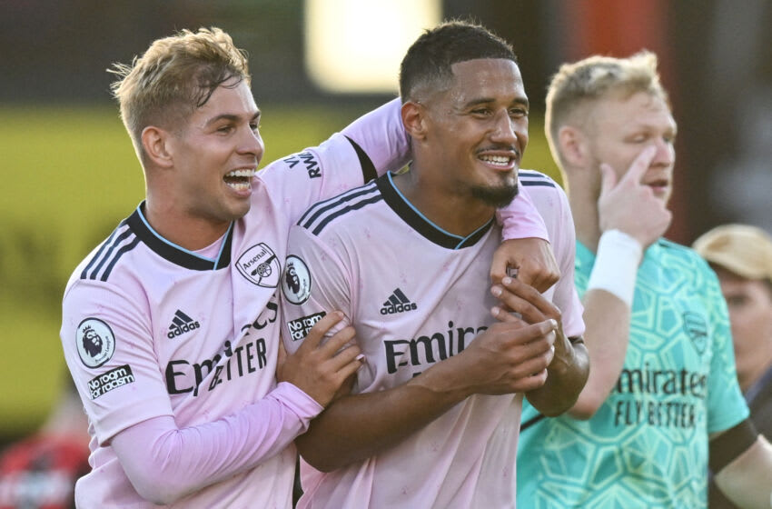 Arsenal's English midfielder Emile Smith Rowe (L) and Arsenal's French defender William Saliba celebrate after winning at the end of the English Premier League football match between Bournemouth and Arsenal at the Vitality Stadium in Bournemouth, southern England on August 20, 2022. - Arsenal won 3 - 0 against Bournemouth. - RESTRICTED TO EDITORIAL USE. No use with unauthorized audio, video, data, fixture lists, club/league logos or 'live' services. Online in-match use limited to 120 images. An additional 40 images may be used in extra time. No video emulation. Social media in-match use limited to 120 images. An additional 40 images may be used in extra time. No use in betting publications, games or single club/league/player publications. (Photo by Glyn KIRK / AFP) / RESTRICTED TO EDITORIAL USE. No use with unauthorized audio, video, data, fixture lists, club/league logos or 'live' services. Online in-match use limited to 120 images. An additional 40 images may be used in extra time. No video emulation. Social media in-match use limited to 120 images. An additional 40 images may be used in extra time. No use in betting publications, games or single club/league/player publications. / RESTRICTED TO EDITORIAL USE. No use with unauthorized audio, video, data, fixture lists, club/league logos or 'live' services. Online in-match use limited to 120 images. An additional 40 images may be used in extra time. No video emulation. Social media in-match use limited to 120 images. An additional 40 images may be used in extra time. No use in betting publications, games or single club/league/player publications. (Photo by GLYN KIRK/AFP via Getty Images)